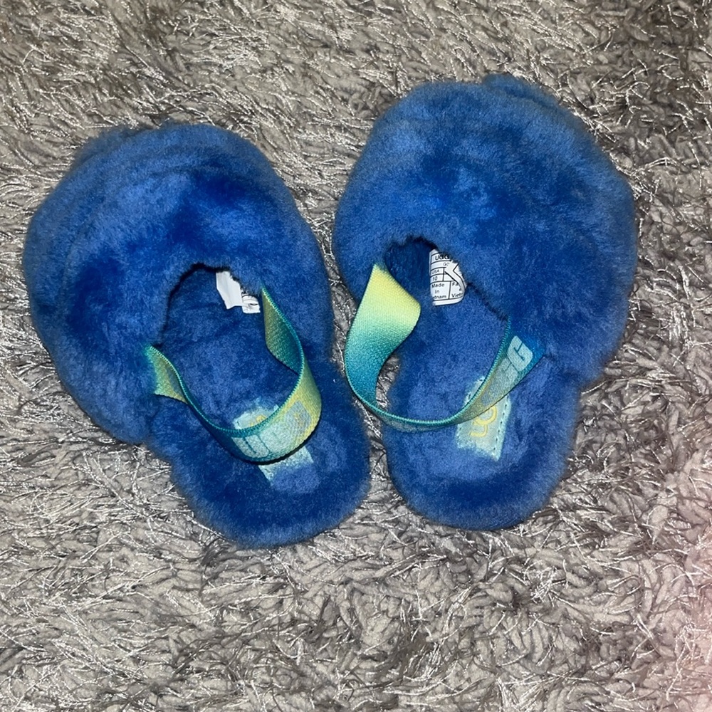 Blue Ugg slides with blue and neon green strap